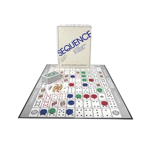 May include: A Sequence board game set. The game includes a game board, a deck of cards, and colored game pieces. The box reads "Sequence" in blue text. The game board features a grid of playing card images.