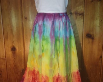 May include: A long, rainbow tie-dye skirt with a ruffled hem. The skirt is made of a lightweight fabric and has a drawstring waist.