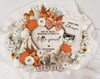 May include: A baby announcement with a white onesie, ultrasound image, and decorative elements. The text reads "Baby Girl Adamson" and "We've been keeping a pretty little secret November 2026". The arrangement includes pumpkins, leaves, and a teddy bear.