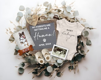 May include: A pregnancy announcement featuring a dog photo, a letter board with the text "MY PARENTS ARE GETTING ME A Human! APRIL 2024", a baby onesie, baby shoes, and an ultrasound image. The announcement is surrounded by greenery.