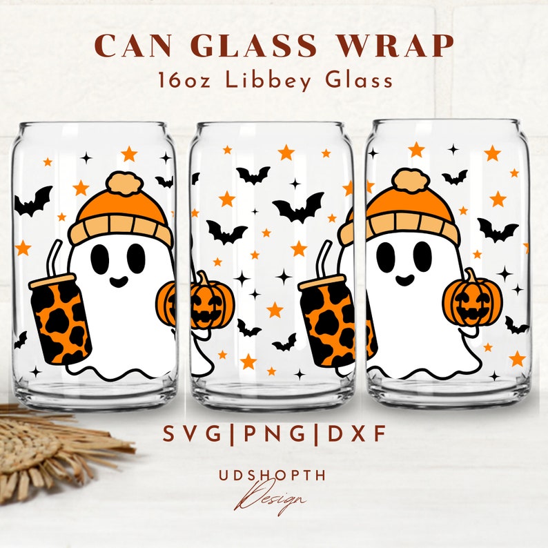 May include: Three 16oz glass can wraps featuring a ghost wearing a hat and holding a pumpkin and a can with a leopard print design. The background features bats and stars. SVG, PNG, and DXF files are included. UDShopTH Design.