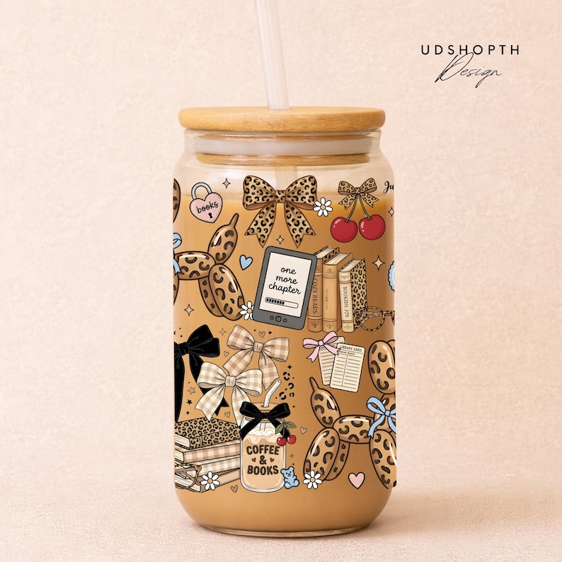 May include: A white ceramic mug with a black handle and the text "But First, Coffee" in a black, handwritten-style font. The mug is on a white surface.
