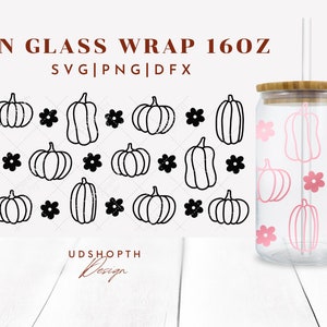 May include: A 16 oz glass can wrap with a black and white pumpkin and flower pattern. The wrap is shown on a clear glass can with a bamboo lid and a straw. The text "CAN GLASS WRAP 160Z" and "SVG|PNG|DFX" is shown above the pattern. The text "UDSHOP&Tau;&Eta; Design" is shown below the pattern.