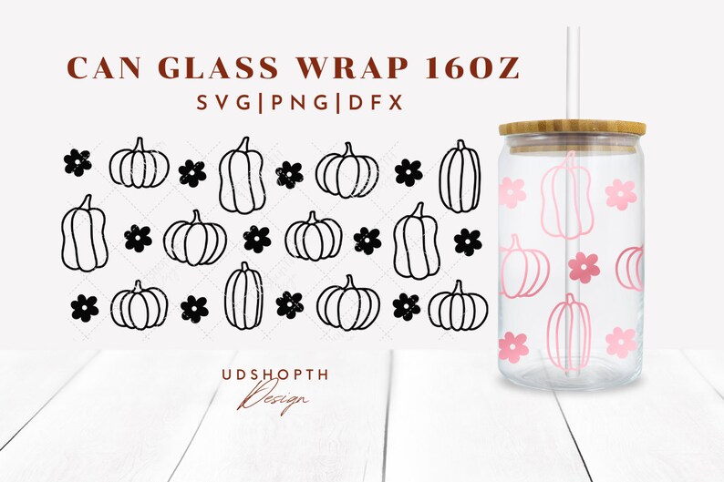 May include: A 16 oz glass can wrap with a black and white pumpkin and flower pattern. The wrap is shown on a clear glass can with a bamboo lid and a straw. The text "CAN GLASS WRAP 160Z" and "SVG|PNG|DFX" is shown above the pattern. The text "UDSHOP&Tau;&Eta; Design" is shown below the pattern.