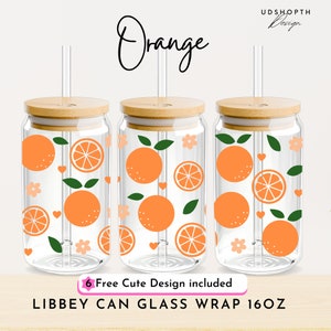 May include: Three clear glass Libbey can wraps, each with a bamboo lid and straw. The wraps feature an orange fruit design with orange slices, green leaves, and small flowers. The word "Orange" is written in a script font.