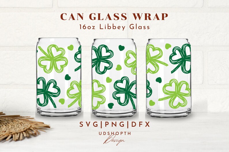May include: Three 16oz Libbey glass can wraps with a green shamrock pattern. The text "CAN GLASS WRAP" and "16oz Libbey Glass" is at the top of the image. The text "SVG|PNG|DFX" and "UDSHOPTH Design" is at the bottom of the image.