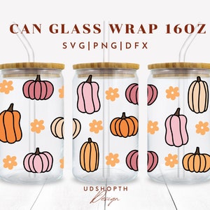 May include: Three clear glass 16oz can wraps with a pattern of orange, pink, and cream pumpkins and orange flowers. The text "CAN GLASS WRAP 160Z" and "SVG|PNG|DFX" is at the top of the image. The text "UDSHOPTH Design" is at the bottom of the image.