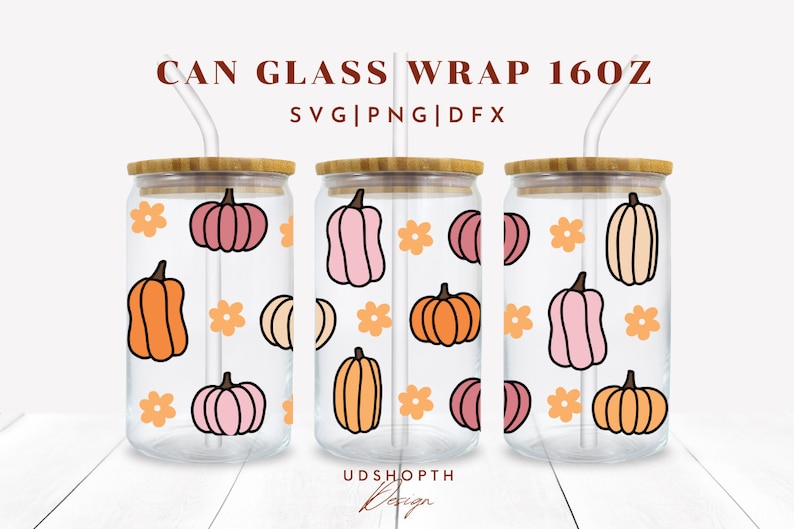 May include: Three clear glass 16oz can wraps with a pattern of orange, pink, and cream pumpkins and orange flowers. The text "CAN GLASS WRAP 160Z" and "SVG|PNG|DFX" is at the top of the image. The text "UDSHOPTH Design" is at the bottom of the image.
