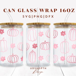 May include: Three clear glass 16 oz. cans with bamboo lids and pink straws. Each can has a pink and white pumpkin and flower pattern. The text "CAN GLASS WRAP 16OZ" and "SVG|PNG|DFX" are at the top of the image.