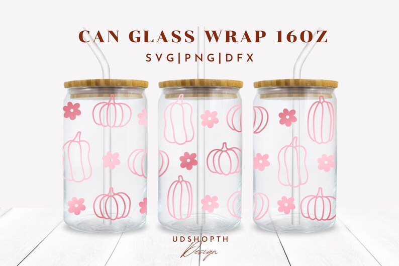 May include: Three clear glass 16 oz. cans with bamboo lids and pink straws. Each can has a pink and white pumpkin and flower pattern. The text "CAN GLASS WRAP 16OZ" and "SVG|PNG|DFX" are at the top of the image.