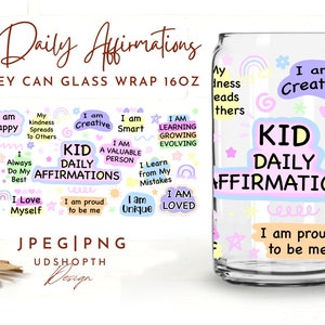 May include: A clear glass can with a pink and blue design featuring the text "Kid Daily Affirmations". The can is decorated with stars, rainbows, and hearts. The text on the can includes positive affirmations for children, such as "I am happy", "I am creative", and "I am loved".