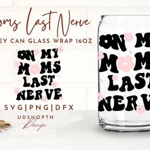 May include: A clear glass can with a black design that says "On My Moms Last Nerve" with pink flowers. The can is 16 ounces and is a Libbey can glass wrap.