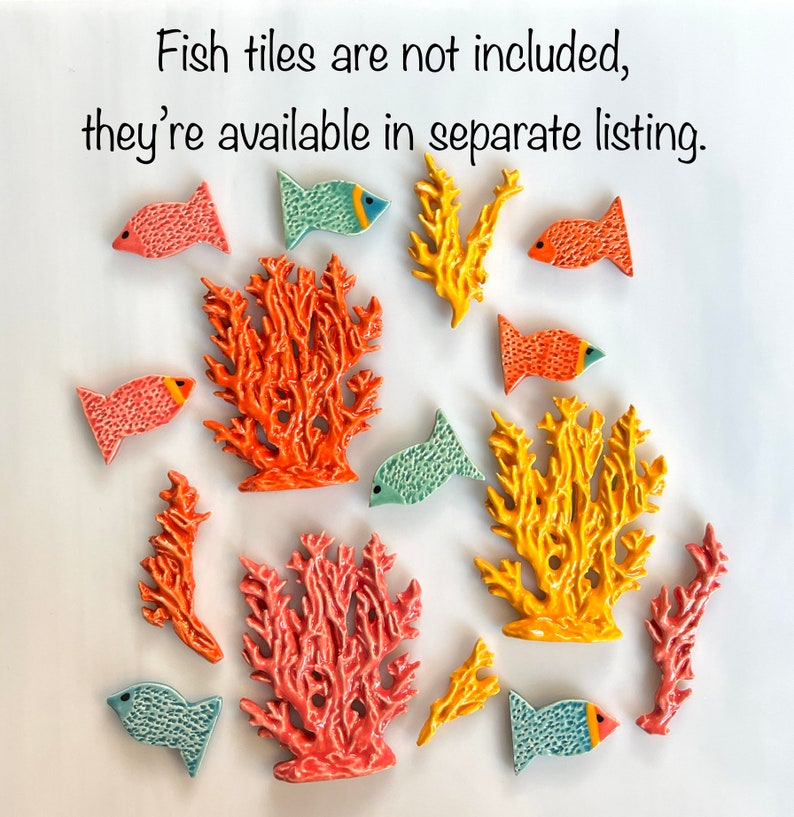 May include: Ceramic coral and fish tiles in shades of orange, yellow, and teal. The fish have orange and blue accents. The text in the image reads: "Fish tiles are not included, they're available in separate listing."