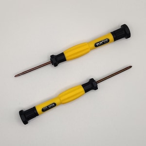 May include: Two yellow and black screwdrivers with different sized tips. The larger screwdriver has the text "1.5X1.5T  #2106" printed on the handle. The smaller screwdriver has the text "1.2X1.2T  #2104" printed on the handle.