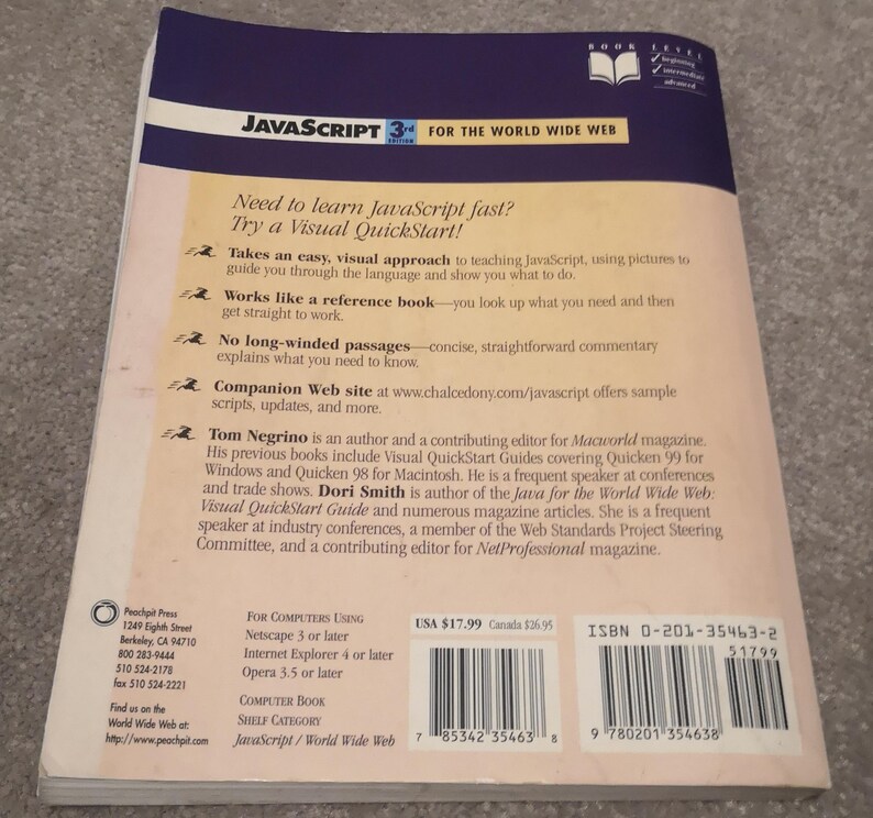 May include: The rear cover of a JavaScript programming book. The title reads "JavaScript 3rd Edition for the World Wide Web." The cover includes text about the book's features and author information. The book is published by Peachpit Press.