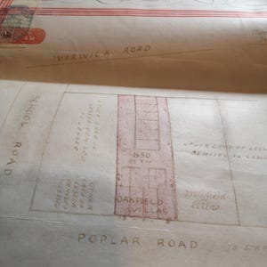 May include: A vintage map with detailed handwritten annotations and architectural plans. Street names include Warwick Road, Poplar Road, and School Road. The map also features the text "Oakfield Villas" and "Mayfield Villas".
