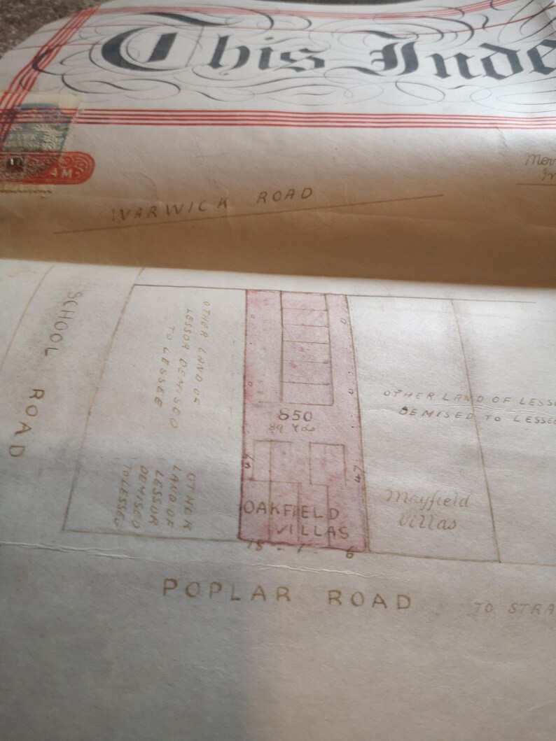 May include: A vintage map with detailed handwritten annotations and architectural plans. Street names include Warwick Road, Poplar Road, and School Road. The map also features the text "Oakfield Villas" and "Mayfield Villas".