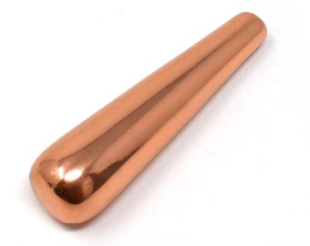 May include: A smooth, polished copper-colored cylindrical tool with a rounded base and a slightly tapered end. The surface is highly reflective, showing a metallic sheen throughout the entire length of the object, which is set against a plain background.