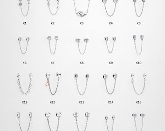 May include: A collection of twenty silver-toned charm safety chains, each with a unique design. The charms include floral, butterfly, and geometric shapes, connected by delicate chains. The items are displayed on a white background.