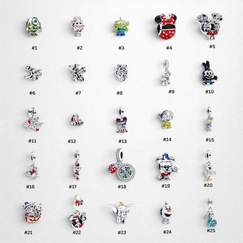 May include: A collection of twenty-five silver-toned metal charms featuring various cartoon characters and symbols, each labelled with a number from 1 to 25. The charms include colourful enamel details, sparkling stones, and intricate designs.