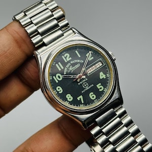 Rare Vintage West End Watch Co Sowan Prima, Automatic Green Military Dial Date/Day Swiss Made Men’s Wrist Watch-