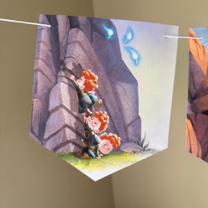 May include: A pennant banner featuring a colorful illustration of three children with red curly hair, stacked on top of each other, reaching towards glowing blue wisps. The background shows a rocky cliff face.