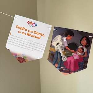 May include: A banner featuring illustrations from the Disney Pixar movie Coco. The banner includes the text "Pepita and Dante to the Rescue!" and a scene of a family. The banner is strung on a white string.