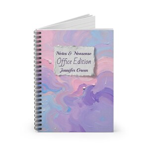 May include: Spiral-bound notebook with a colorful abstract design in shades of pink, purple, and blue. The cover features the text "Notes & Nonsense Office Edition" and the name "Jennifer Green" on a textured paper patch.