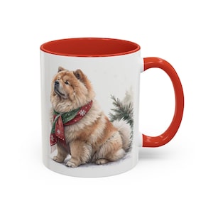 May include: White ceramic mug with a red interior and handle. The mug features a watercolor illustration of a Chow Chow dog wearing a red and green scarf with snowflakes. The dog is set against a wintery background.