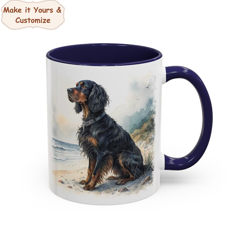 May include: White ceramic mug with a navy blue interior and handle. The mug features a watercolour illustration of a black and brown dog sitting on a beach. The mug has the text "Make it Yours & Customize".