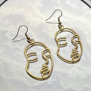 Outlined Face Shaped Earrings - Gold