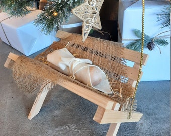 Simple Manger with Gold Star and Baby Jesus