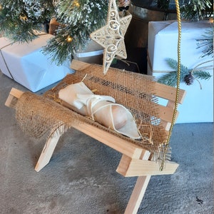 Simple Manger with Gold Star and Baby Jesus