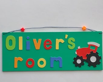Any Name! Tractor themed personalised name plate with green background.