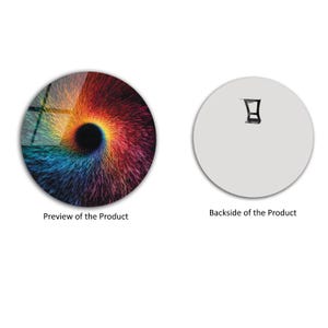 May include: A round wall art piece with a colorful, abstract design. The front features a swirling pattern of red, orange, yellow, blue, and purple. The back is plain white with a mounting bracket.