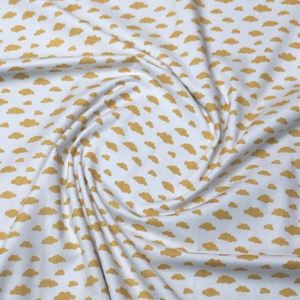 Mini clouds ochre yellow on white . 100% cotton fabric, wide roll 160cm wide