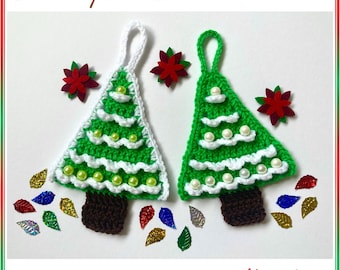 May include: Two green crochet Christmas tree ornaments with white trim, adorned with pearl beads. The trees have brown trunks and white hanging loops. The image includes the text "Crochet patterns" and "HueLaVive".