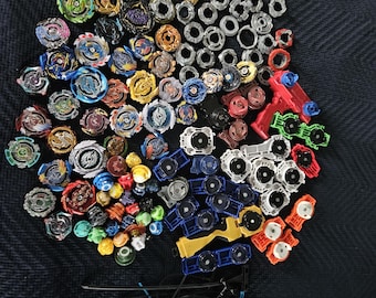Beyblade Collectible toys mixed lot of tops, forge discs etc