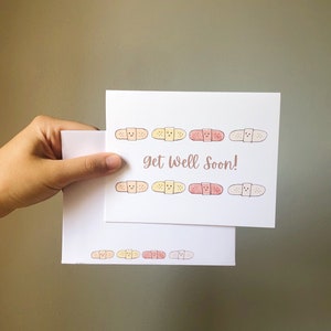 Gute Besserung Bandaid Aquarell Notizkarte Grußkarte mit Option zum Hinzufügen einer persönlichen Nachricht und Senden an den Empfänger