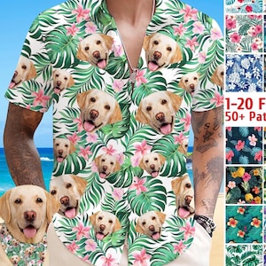 May include: White short-sleeved shirt featuring a pattern of Labrador Retriever faces, pink flowers, and green tropical leaves. The shirt has a silver zip and a collar. Part of a collection with 20+ patterns.