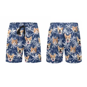 May include: Blue swim trunks with a pattern of palm trees and dog and cat faces.