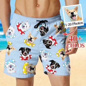 May include: Light blue swim trunks featuring a repeating pattern of various dog breeds in inflatable rings. The trunks have a black drawstring and a small photo of a dog. The text "1-20 Photos" and "40+ COLOS" are also visible.