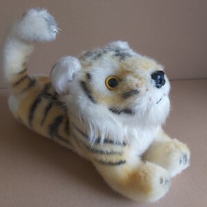 Tiger plush vintage. Lying tiger vintage plush. Stuffed tiger vintage