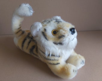 Tiger plush vintage. Lying tiger vintage plush. Stuffed tiger vintage