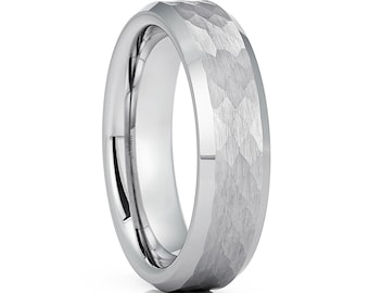 May include: A silver tungsten carbide ring with a hammered finish. The ring has a beveled edge and a polished interior.