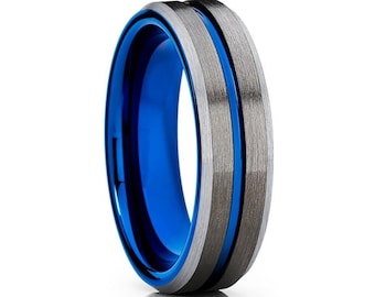 May include: A blue and gray tungsten carbide ring with a brushed finish. The ring has a blue center band and a gray outer band.