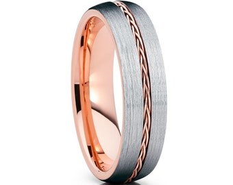 May include: A brushed silver wedding band with a rose gold braided inlay.