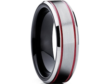 May include: A black tungsten carbide ring with a brushed silver band and two red lines.
