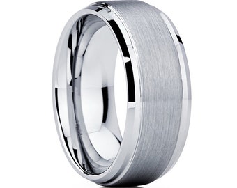May include: A silver tungsten carbide ring with a brushed finish and a polished beveled edge.