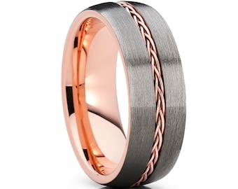 May include: A brushed grey tungsten carbide ring with a rose gold braided inlay.